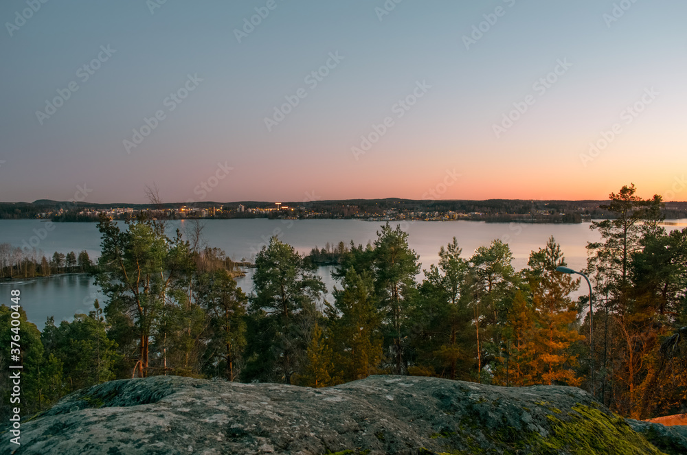 Sunset over lake and forest in Tampere Finland