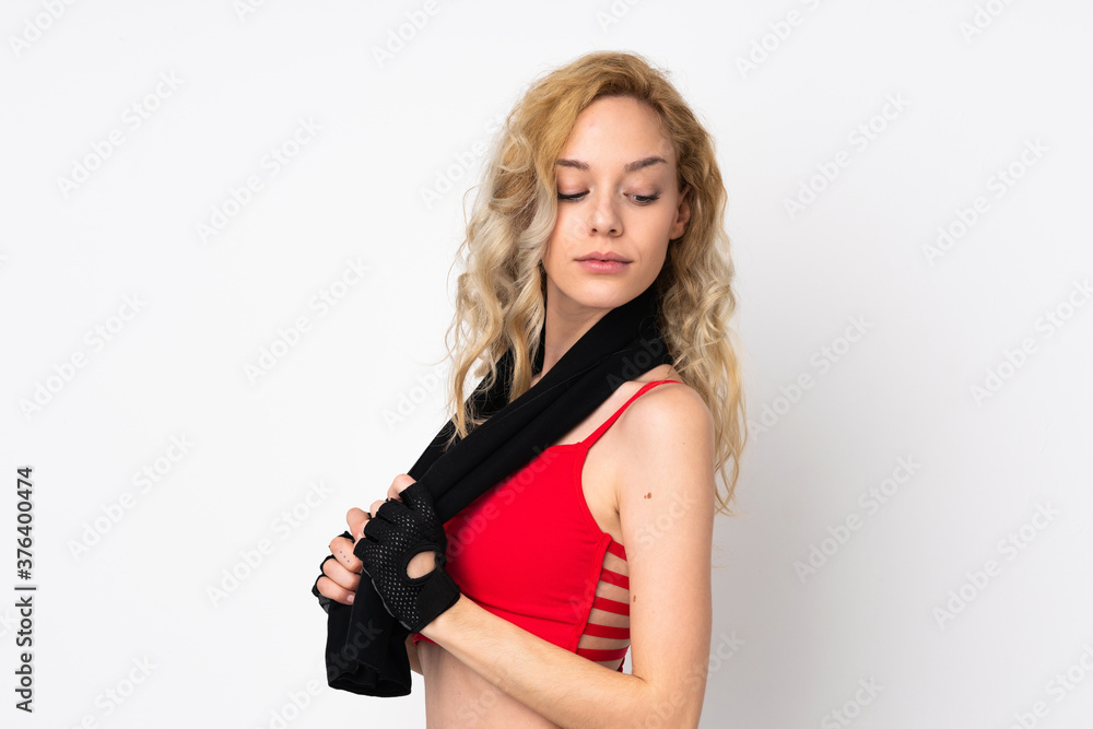 Young blonde woman isolated on white background with sport towel Young blonde woman isolated on white background with sport towel