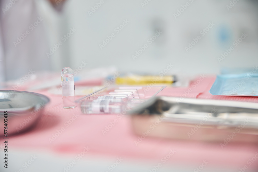 Pharmaceuticals and stainless steel trays used for a medical procedure