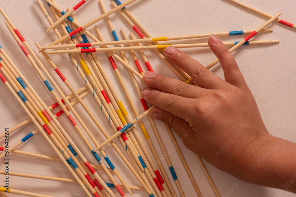 Close-up of a child hand playing in shanghai
