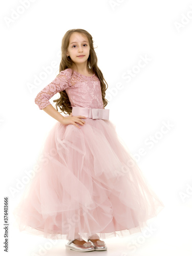 Portrait of Teen Girl in Dress Standing Half Turn.
