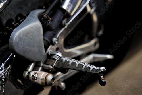 Close up of a motorcycle clutch pedal on a vintage motorbike.