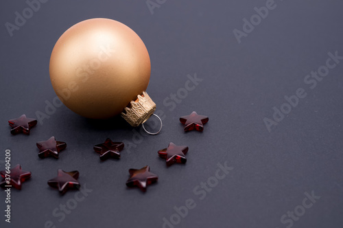 Closeup high angle macro shot of a Christmas ornament on a black surface photo