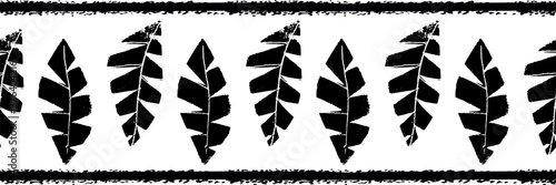 Mono print style scattered grunge leaves seamless vector border background. Black and white banner of vertical textured cut out foliage. Hand crafted painterly stamp design. For ribbon, edging, trim