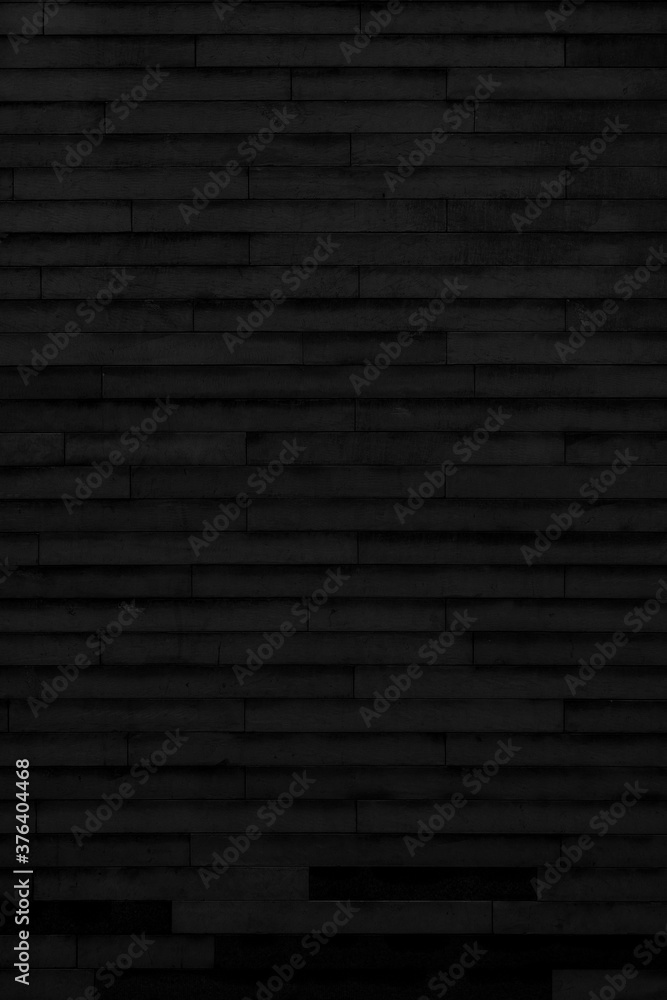 Black brick building wall. Interior of a modern loft. Background for design Black brick building wall. Interior of a modern loft. Background for design