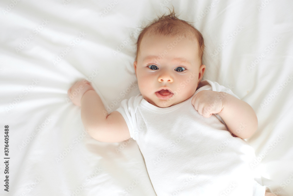 Infant child. The child lies on a blanket.High quality photo. Infant child. The child lies on a blanket.High quality photo.