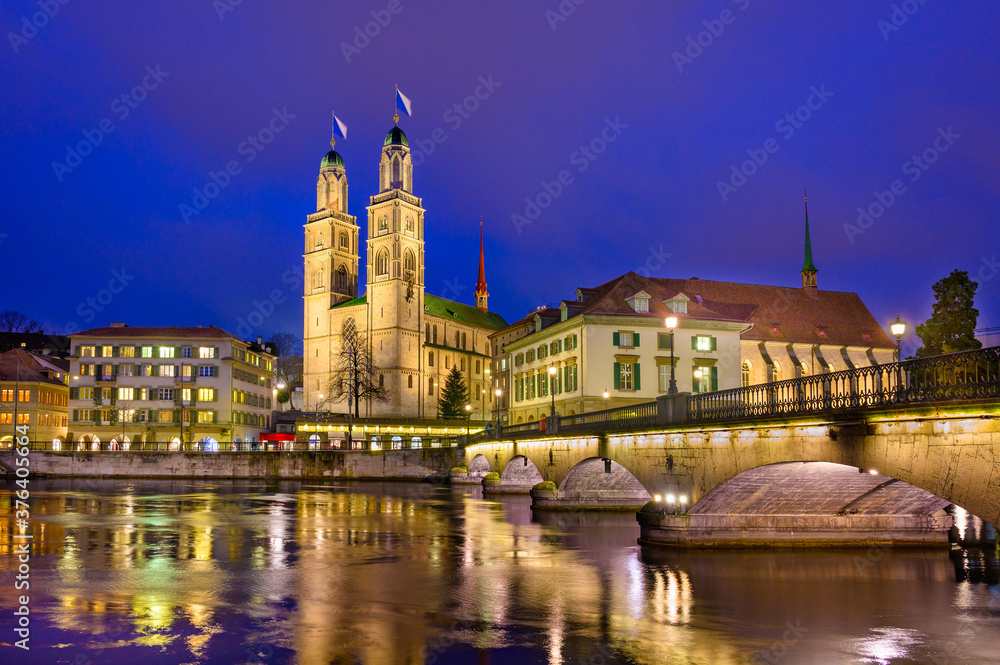 Night view of cathedral Grossmunster  in old city of Zurich, Switzerland.