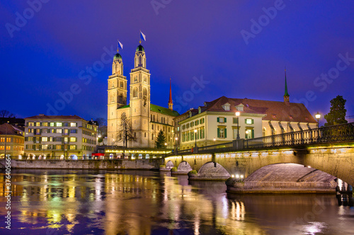 Night view of cathedral Grossmunster in old city of Zurich, Switzerland.