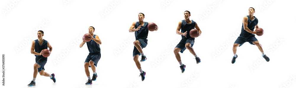 High flight. Young basketball player of team training in action, motion in jump of step-to-step goal isolated on white background. Concept of sport, movement, energy and dynamic, healthy lifestyle.