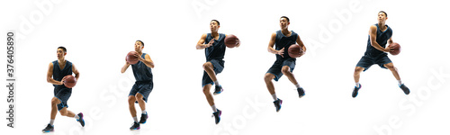 High flight. Young basketball player of team training in action, motion in jump of step-to-step goal isolated on white background. Concept of sport, movement, energy and dynamic, healthy lifestyle. © master1305