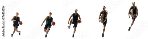 Stronger. Young basketball player of team training in action, motion in jump of step-to-step goal isolated on white background. Concept of sport, movement, energy and dynamic, healthy lifestyle.
