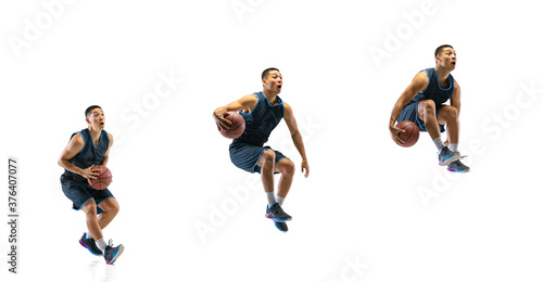 Tensioned. Young basketball player of team training in action, motion in jump of step-to-step goal isolated on white background. Concept of sport, movement, energy and dynamic, healthy lifestyle.