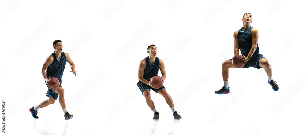 Flying. Young basketball player of team training in action, motion in jump of step-to-step goal isolated on white background. Concept of sport, movement, energy and dynamic, healthy lifestyle. Flying. Young basketball player of team training in action, motion in jump of step-to-step goal isolated on white background. Concept of sport, movement, energy and dynamic, healthy lifestyle.
