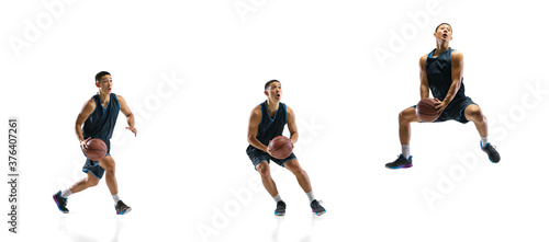 Flying. Young basketball player of team training in action  motion in jump of step-to-step goal isolated on white background. Concept of sport  movement  energy and dynamic  healthy lifestyle.