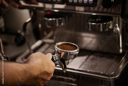 barista prepare blend coffee powder to make espresso coffee
