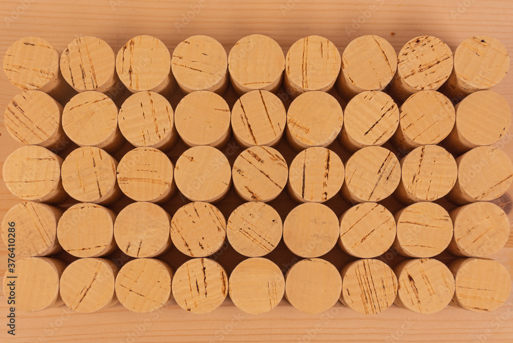 Cork stoppers for wine bottles arranged neatly and geometrically for commercial, brand and advertising use Cork stoppers for wine bottles arranged neatly and geometrically for commercial, brand and advertising use