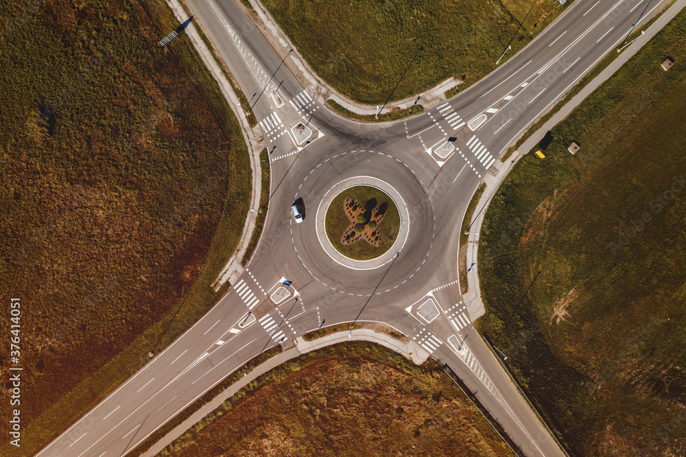 Cars on road intersection roundabout