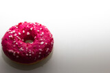 pink doughnut with sprinkles isolated