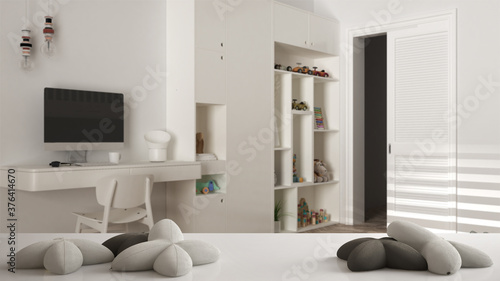 White table  desk or shelf with five soft white pillows in the shape of stars or flowers  over blurred modern children bedroom with desk  white architecture interior design