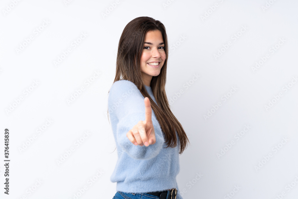 Young teenager Brazilian girl over white background Young teenager Brazilian girl over white background