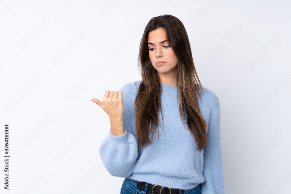 Young teenager Brazilian girl over white background Young teenager Brazilian girl over white background