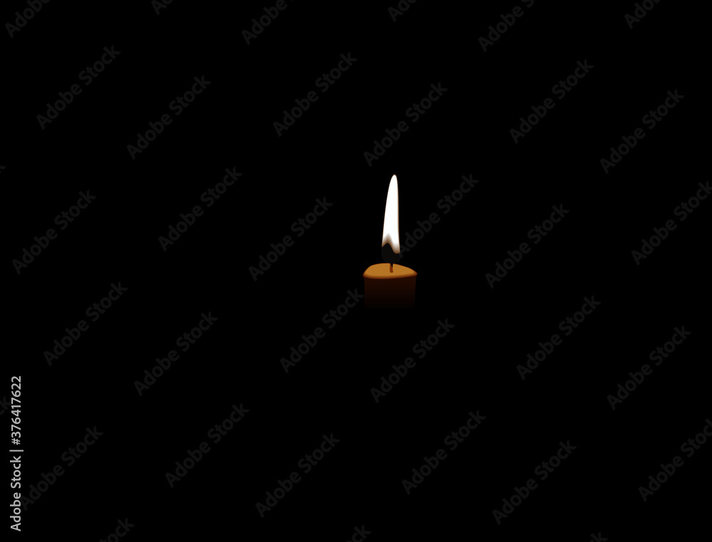 Fototapeta premium A candle burning in a dark room