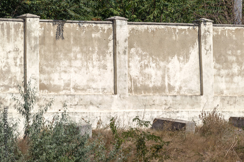 Wallpaper Mural An old stone plastered cement wall as a background for any design. Texture of a plastered stone wall high in a summer park. Perspective background for the collage Torontodigital.ca
