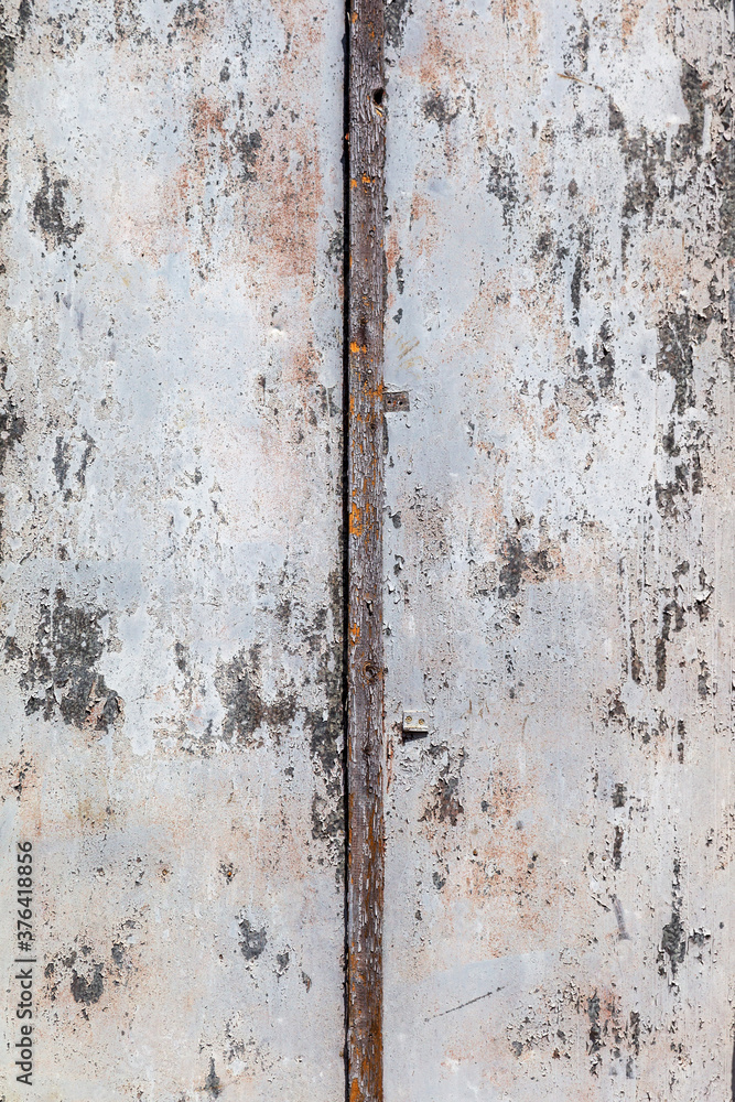 Wooden conceptual background. Old painted background of wooden boards. Traces of an old cracked peeling paint on wooden shield. Concept of antiquity on surface of an old painted wooden racket shield Wooden conceptual background. Old painted background of wooden boards. Traces of an old cracked peeling paint on wooden shield. Concept of antiquity on surface of an old painted wooden racket shield