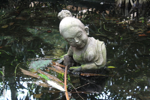 statue of a person in a garden
