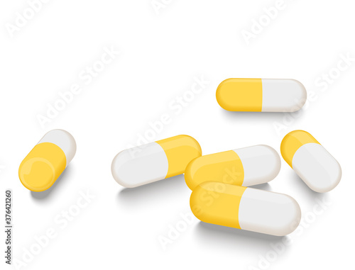 White yellow capsules scattered about