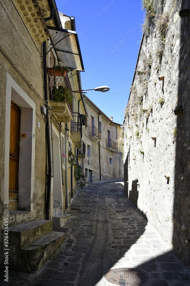 A small road crosses the old buildings of Calvello, a old Town in the Basilicata region, Italy.

