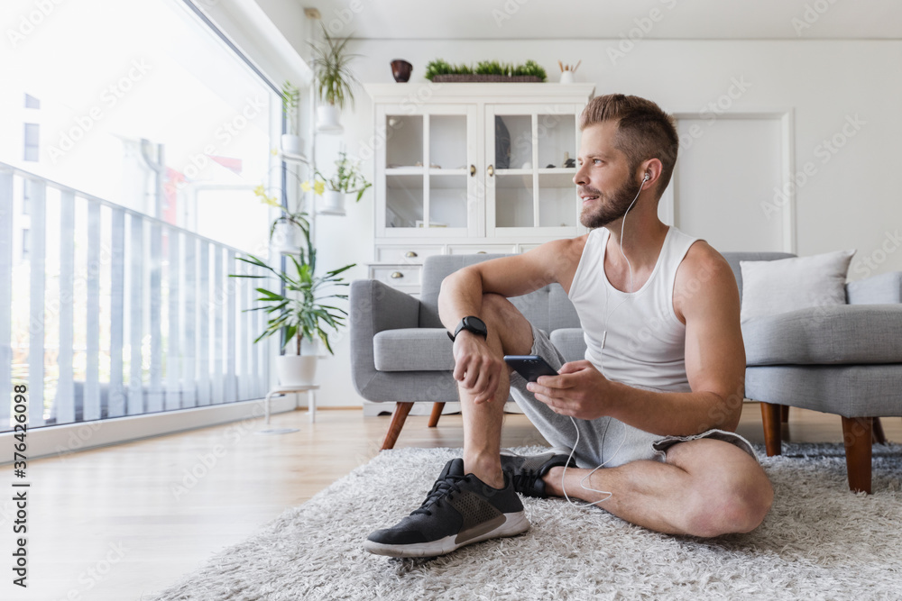 Handsome man working out at home Handsome man working out at home