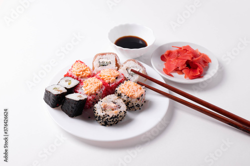 asian rice rolls on the white plate. white background.