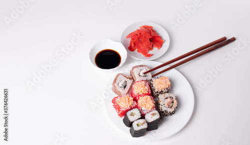 asian rice rolls on the white plate. white background.