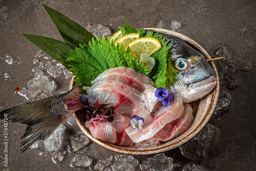 Delicious fresh fish on dark background