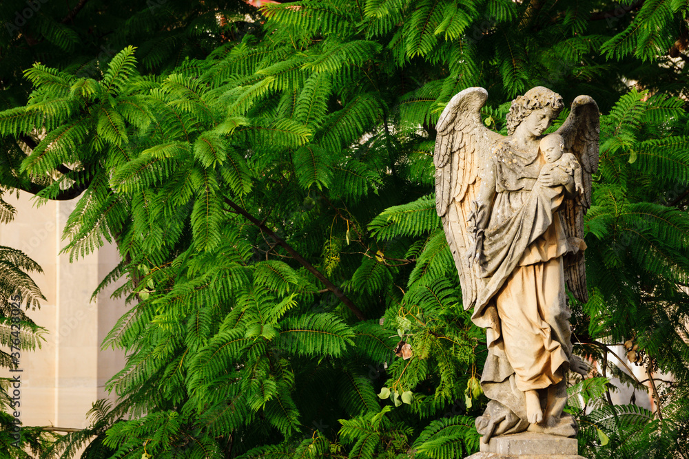 angel con un niño en brazos, cementerio historico de palma, inaugurado el 24 de marzo de 1821,Palma,  Mallorca, islas baleares, Spain