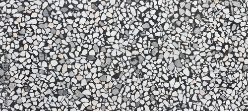 Smooth small stones in concrete banner background, wall or natural flooring texture