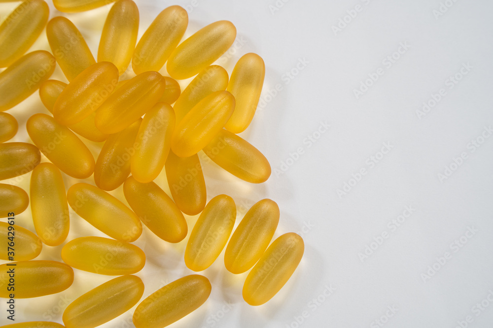 Close up the vitamin D and Omega 3 fish oil capsules supplement for good brain , heart and health eating benefit Close up the vitamin D and Omega 3 fish oil capsules supplement for good brain , heart and health eating benefit