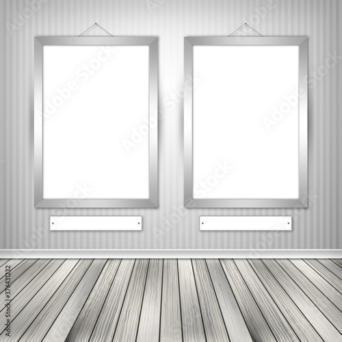 Gallery interior with two empty frames on wall