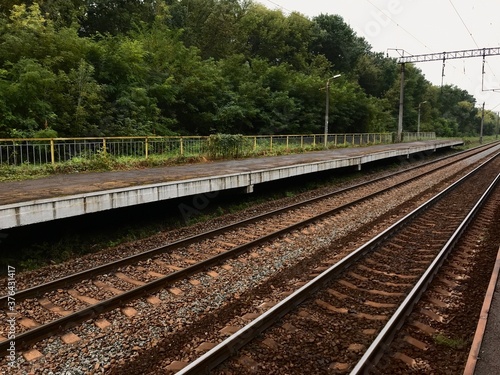 Railway suburban empty platform for commuter trains. Train quarantine and closure concept.