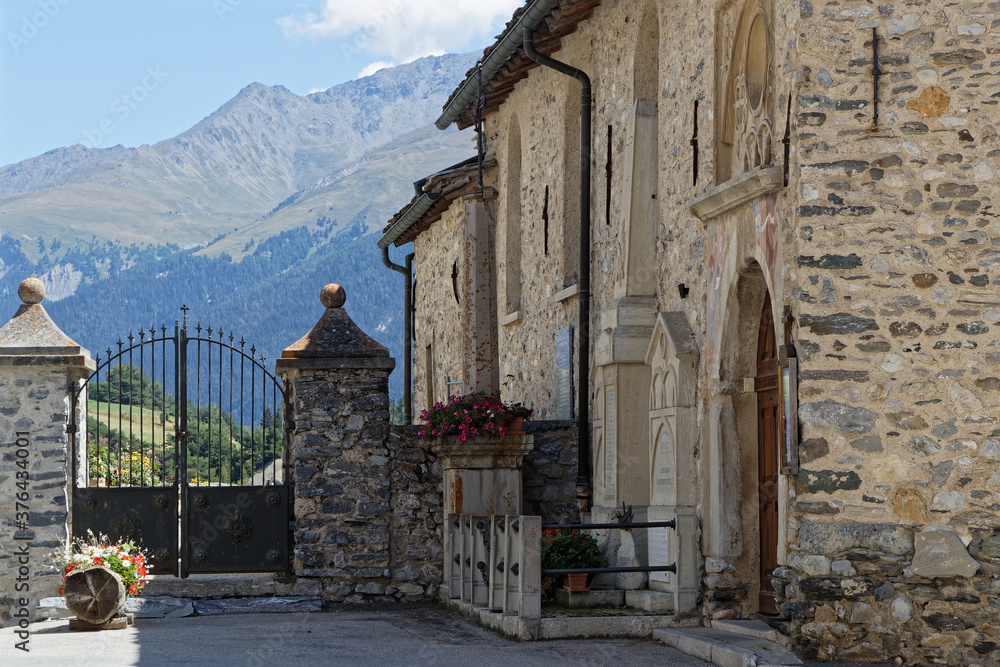 The church entrance of Aussois. Although not as well known as other resorts on the other side of Vanoise, it is popular for French as ski resort in winter and mountain destination in summer.