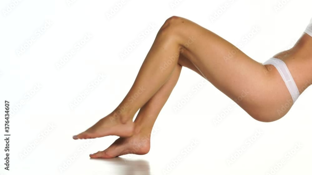 nicely groomed female legs on a white background nicely groomed female legs on a white background