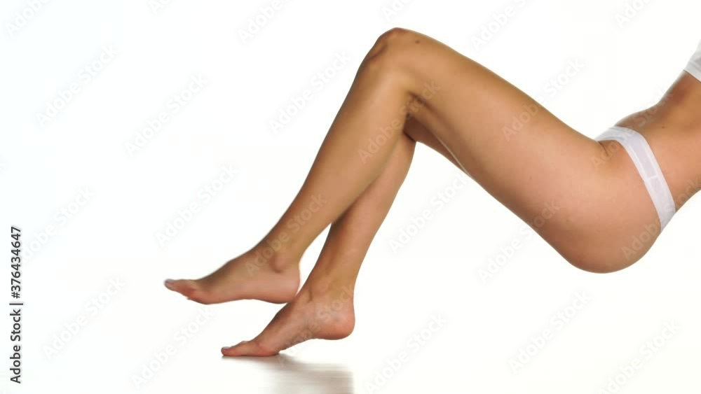 nicely groomed female legs on a white background nicely groomed female legs on a white background