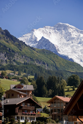 The village of Wengen above the Lauterbrunnen valley with the Jungfrau in the distance: Bernese Oberland, Switzerland 