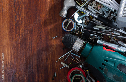 Foto Variety of building hardware and tools with space for text