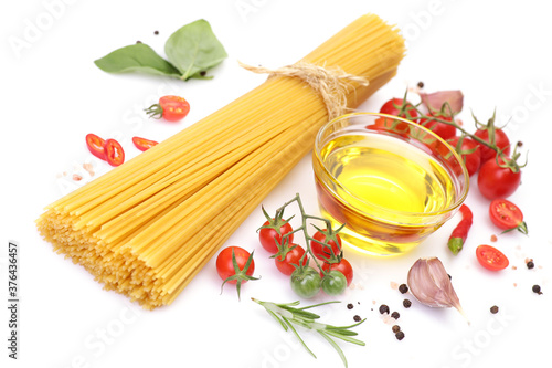 Pasta spaghetti, vegetables and spices,oil olives, isolated on white