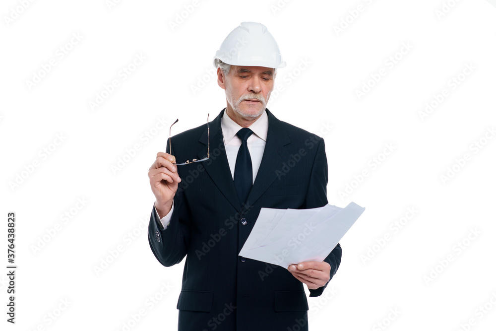 Older business man, civil engineer wear a white safety helmet with project paper isolated on white background Older business man, civil engineer wear a white safety helmet with project paper isolated on white background