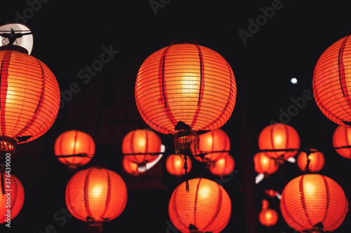 Beautiful round red lantern hanging on old traditional street  concept of Chinese lunar new year festival in Taiwan  close up. The undering word means blessing.