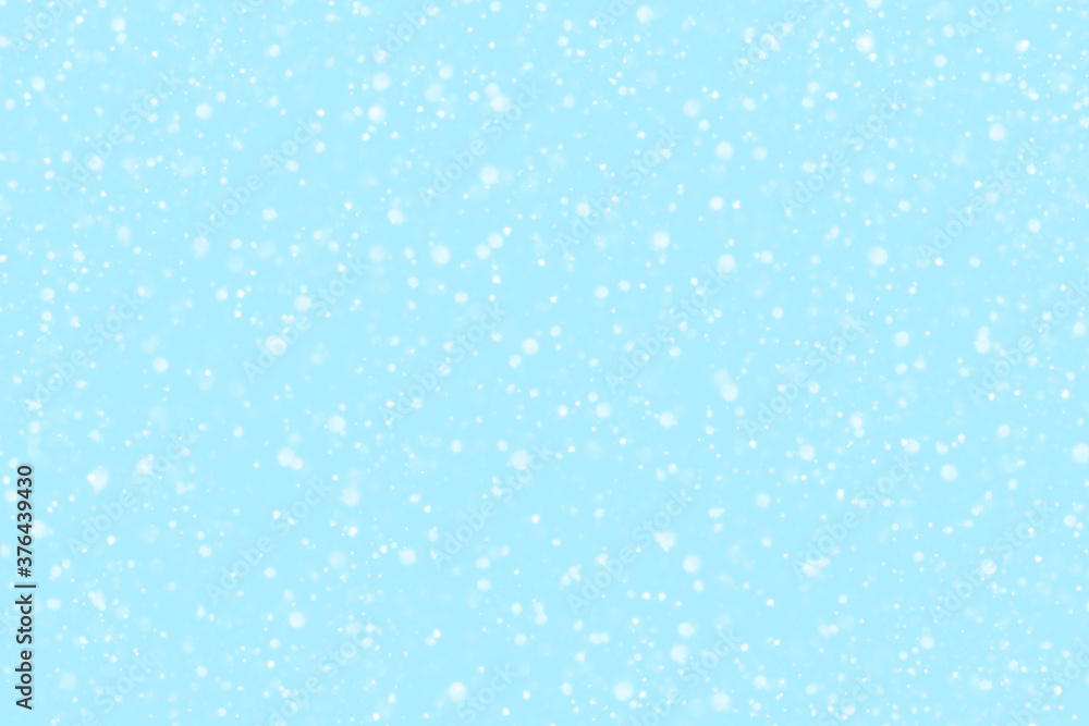 Abstract light blue and white snowfall background.  Concept of New Year, Christmas and All Celebrations.