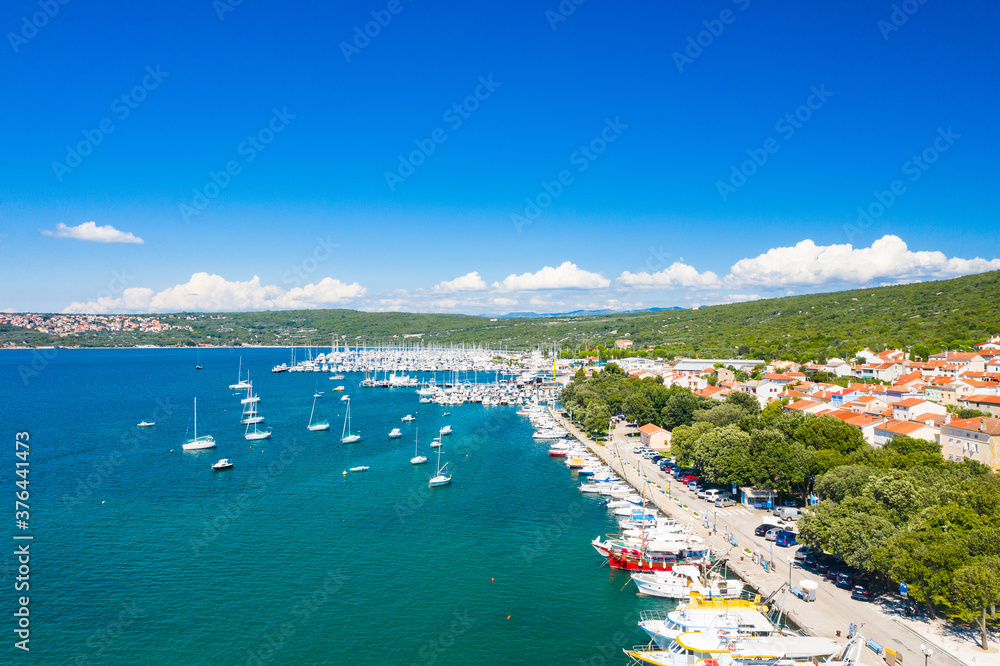 Marina in town of Punat on Krk island, Kvarner bay, Croatia, aerial view from drone
